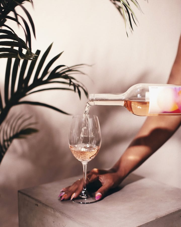 blusgh wine being poured down into a wine glass