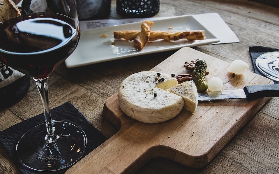 a charcuterie plate with Artisanal Cheese cut