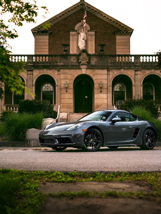 a Ultra-Luxury Car in front of a mansion
