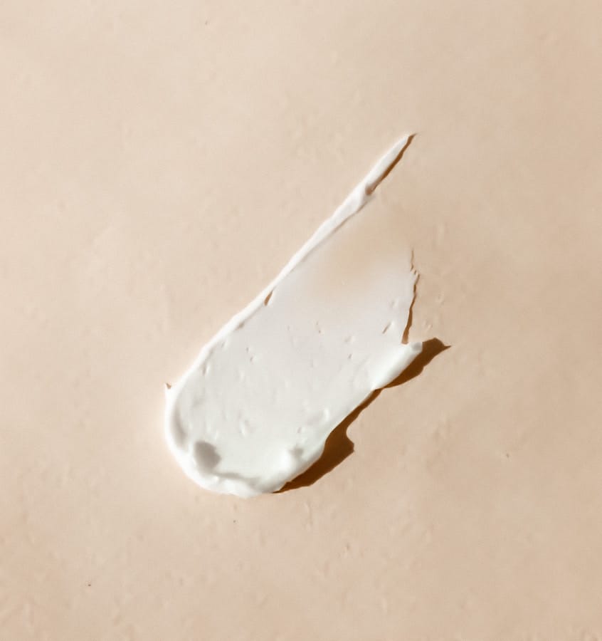 a luxury skincare cream on a surface