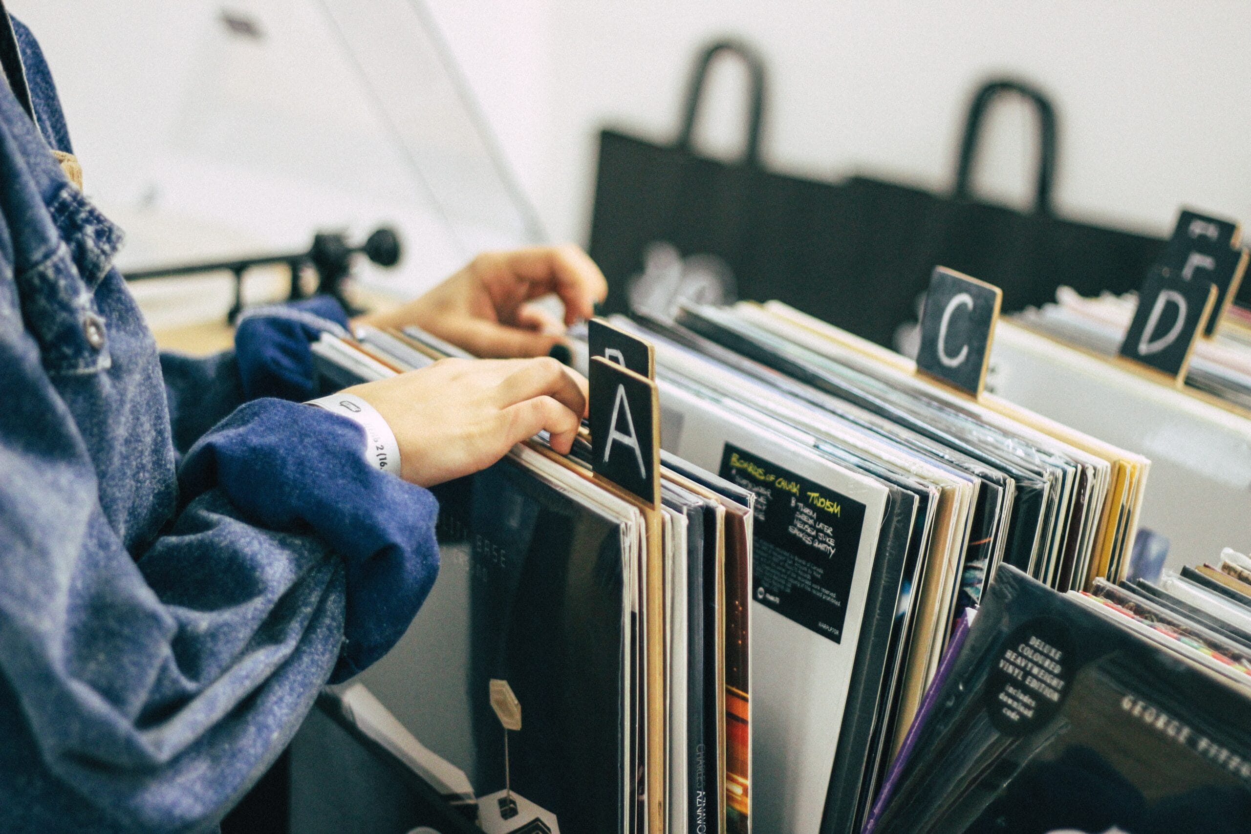 a person looking at Vinyl Records at a Vinyl Records shop
