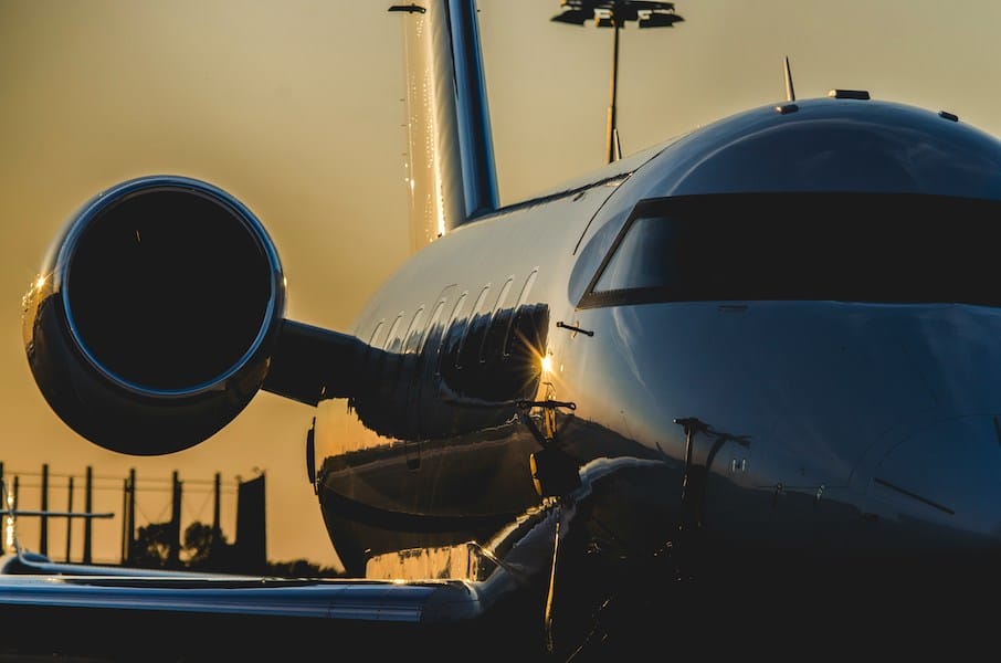 the right side of a private jet in sunset
